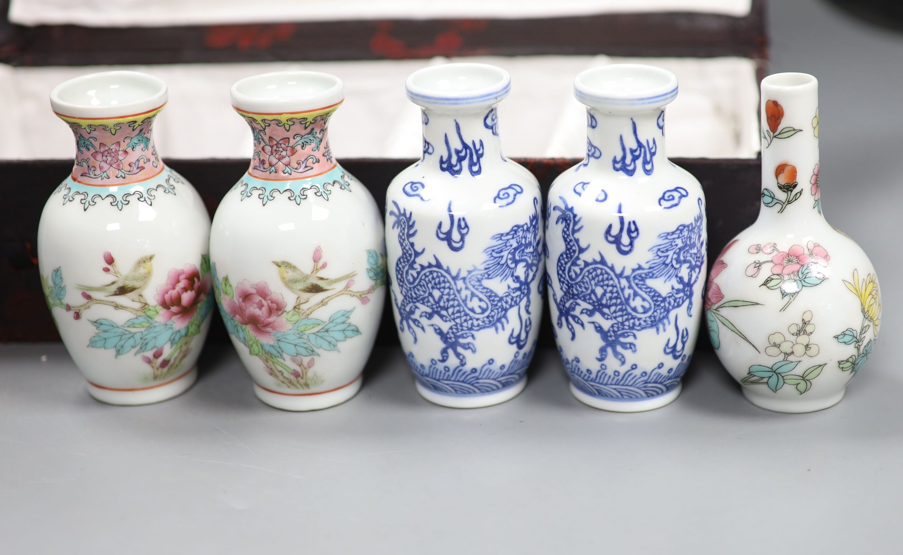 A boxed set of five small Chinese vases